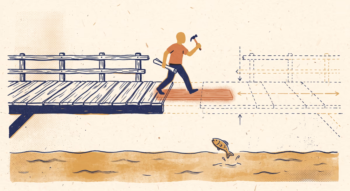 A terracotta-shirted figure mid-stride on a bridge, leading foot landing on a translucent blueprint plank materialising beneath them; solid wooden planks behind, dashed-line construction blueprint ahead; hammer in one hand, blueprint roll in the other; below the bridge, a small fish leaps from the water — building the channel infrastructure as the buyer crosses to it.